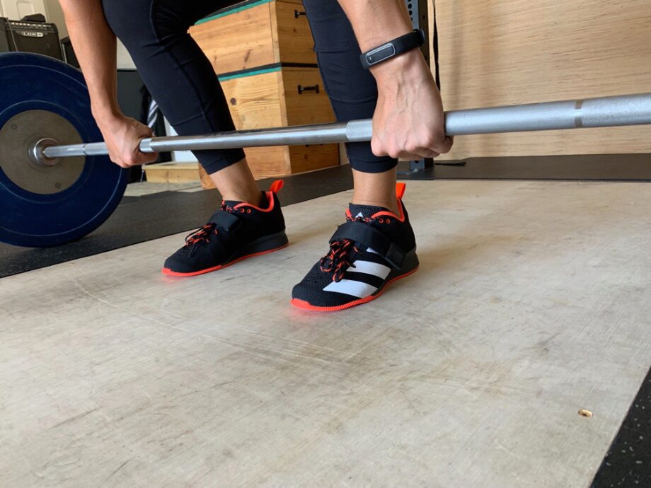 Woman set up for a deadlift wearing the Adidas Adipower 2 weightlifting shoes