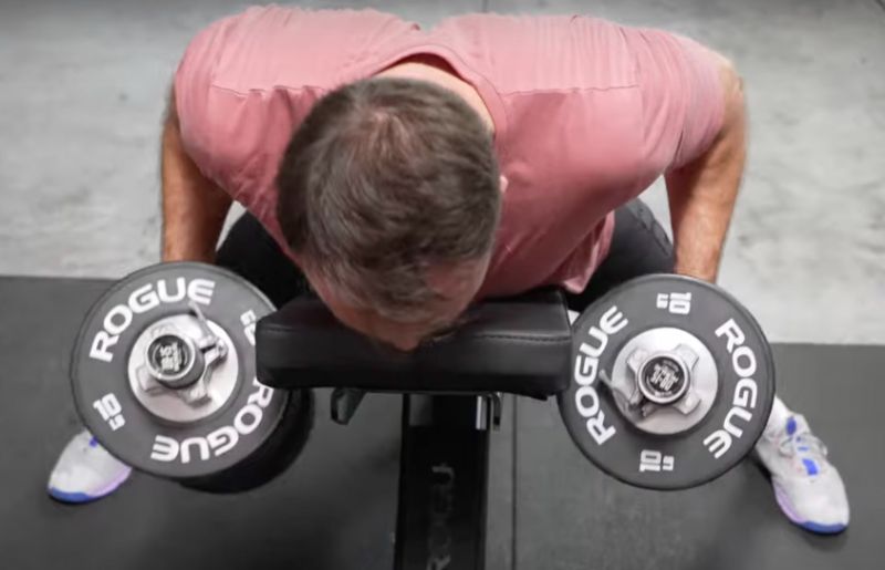 Coop performing chest-supported rows with the Rogue Loadable Dumbbells