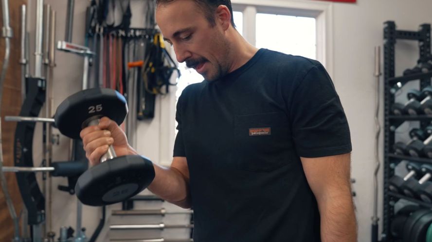 Coop curling the Eleiko rotating EVO dumbbells