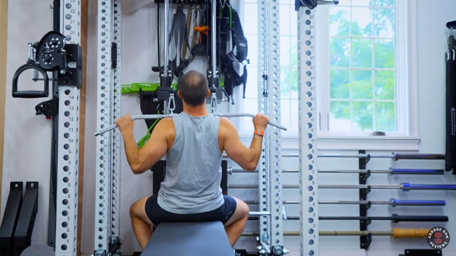 Man doing lat-pulldowns on REP Ares