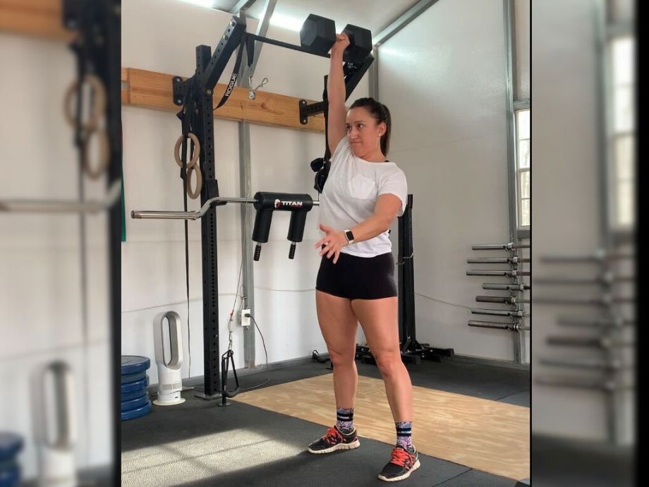 woman using living fit dumbbell