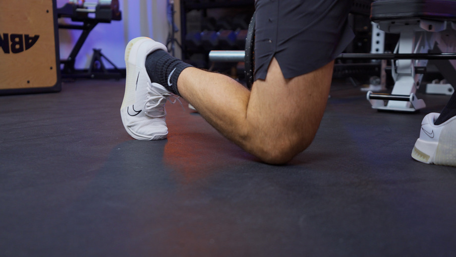 An image of a man lunging in the Nike Metcon 9s, the best cross-training shoe