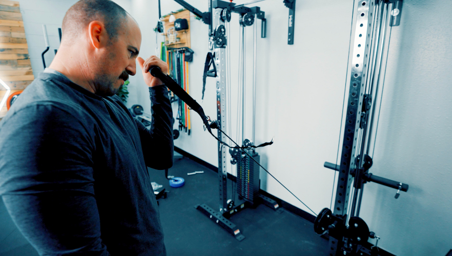 Coop doing biceps curls with the Bells of Steel Cable Tower with Weight Stack