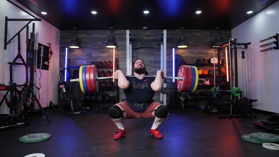 Caine performing a clean on the REP Fitness Alpine Bar