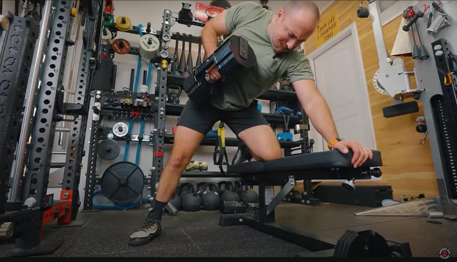 Man performing a one-arm row with the REP x Pepin Fast Series dumbbells